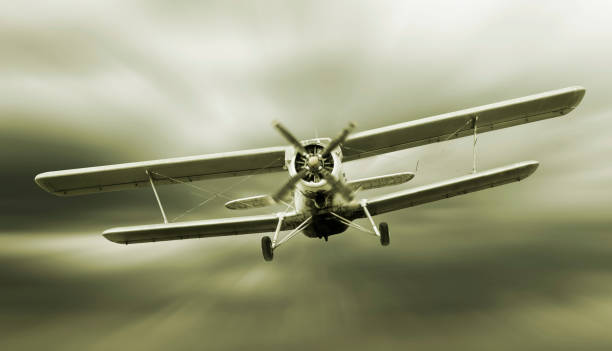 istock Biplane flying in the cloudy sky. Retro style 1070273558