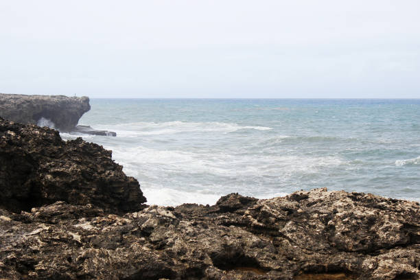 istock Dark stones and ocean waves crashing 1070275712
