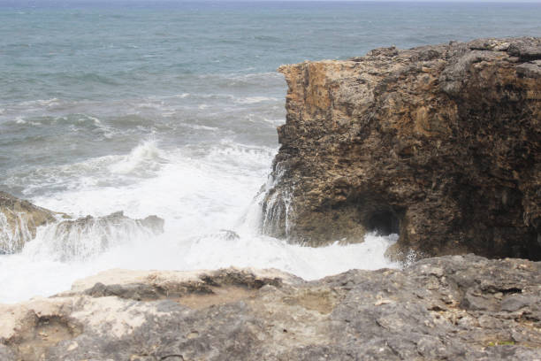 istock Waves crashing on rock after a hurricane 1070276014