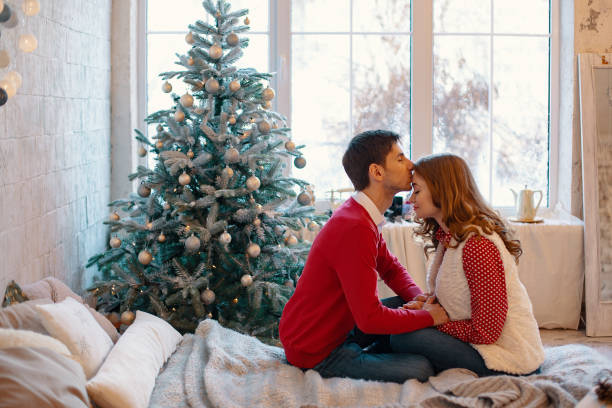 istock Happy loving couple enjoying Christmas 1070276194