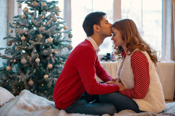 istock Happy loving couple enjoying Christmas 1070276210