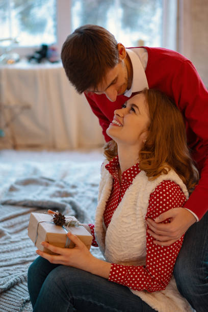 istock Happy loving couple enjoying Christmas 1070276264