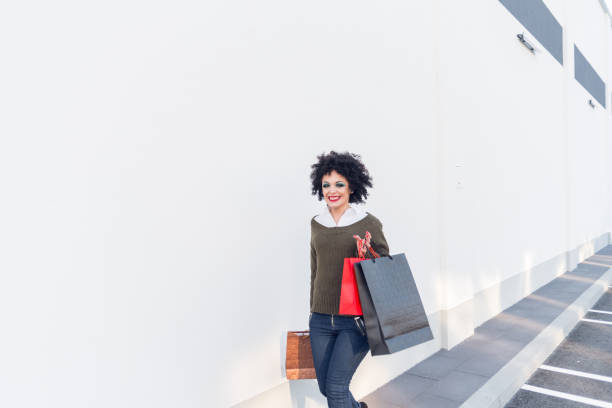 istock Happy girl shopping in mall 1070277882