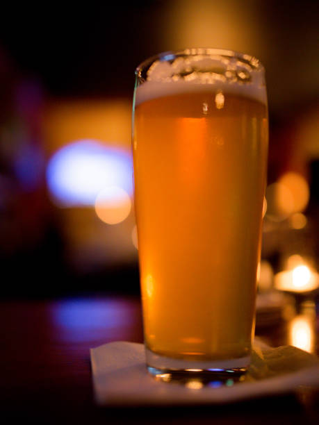 istock Glass of Beer, Pub Bar Counter Restaurant Interior Blurry Background 1070288532
