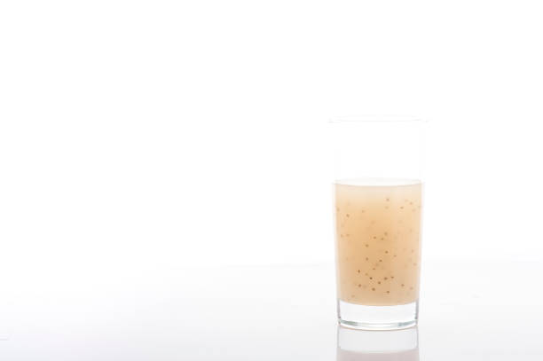 Glass soursop juice mixed with Chia Seeds isolated with white background.