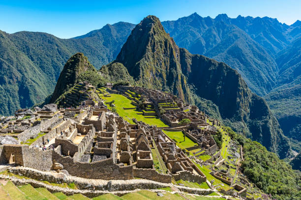 Machu Picchu, Peru Wide angle photograph of the Lost City of the Inca, the ruin of Machu Picchu, on a sunny summer day located near Cusco, Peru. machu picchu photos stock pictures, royalty-free photos & images