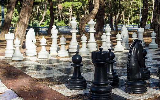 Close up big outdoor chess set in public park.