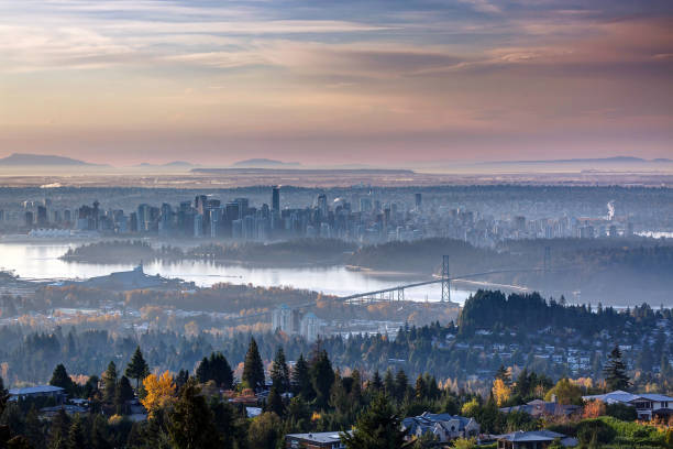 city in mist at sunrise, Vancouver, BC, Canada city in mist at sunrise, Vancouver, BC, Canada sound port stock pictures, royalty-free photos & images