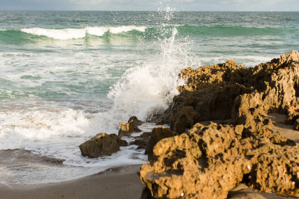 The bright teal rocky seashore of Hutchinson Island, Florida.\n\nKnown for beautiful beaches, nature preserves and parks, Hutchinson Island consists of two barrier islands on the coast of Martin, St. Lucie, and Indian River counties, Florida. The two islands are separated by the Fort Pierce Inlet and are known as North Hutchinson Island and South Hutchinson Island.