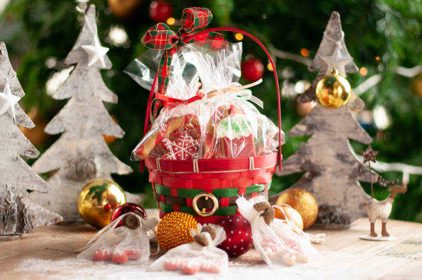 Christmas and New year gifts and baskets with sweets, alcohol, chocolate. christmas gift basket stock pictures, royalty-free photos & images