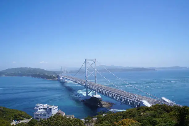 The Ōnaruto Bridge (Ōnaruto-kyō, lit. "Great Naruto Bridge") is a suspension bridge on the route connecting Minamiawaji, Hyogo on Awaji Island with Naruto, Tokushima on Ōge Island, Japan. Completed in 1985, it has a main span of 876 metres (2,874 ft).