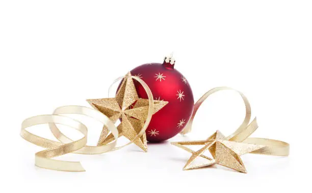 Photo of Christmas holiday bauble with gold star decorations and ribbon isolated