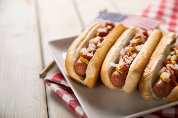 istock Hot Dog Picnic on White Bench 1070315132