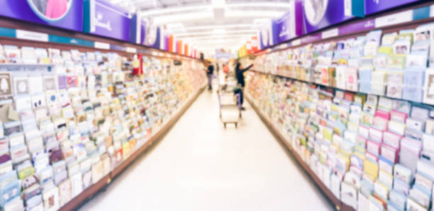 istock Panoramic view blurry background customer selecting greeting cards at supermarket in USA 1070315156