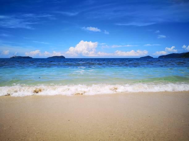 istock Sandy beach splashing water and wave 1070317804
