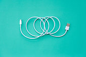 Spiral USB Cable on Turquoise Background Top View