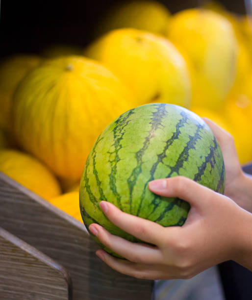 istock Female hand choosing vegetables in the market 1070323468