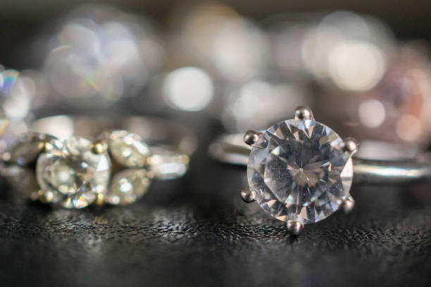 istock Jewelry diamond rings set on black background close up 1070323744