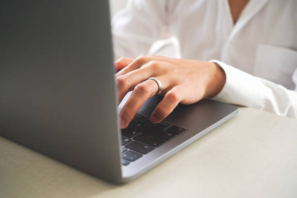istock Close up businessman hand working with laptop typing message on keyboard. 1070324526