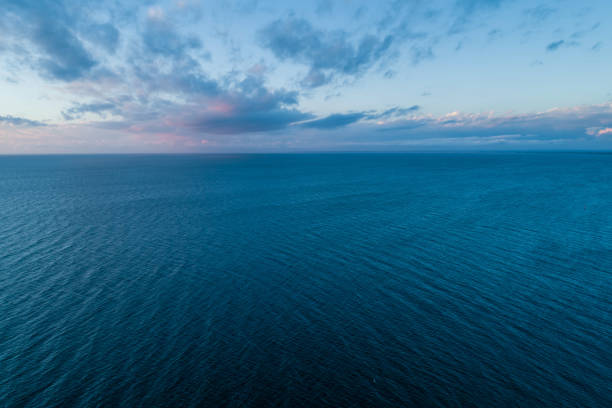 istock Minimalistic seascape - clouds over water at dusk 1070326238