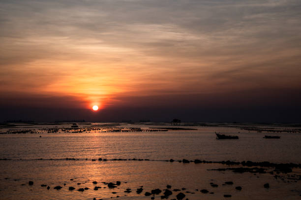 istock Beautiful Sunset Sunrise Sky over tropical sea landscape with copy space. 1070330816