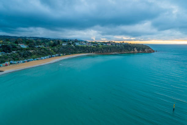 istock Aerial view of Mount Martha beach with bathing boxes at sunset 1070337308