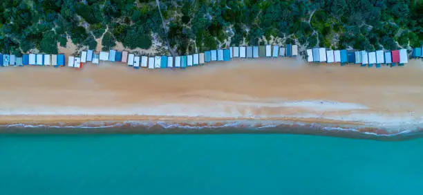 Aerial panorama of long row of beach huts and beautiful turquoise water in Melbourne, Australia