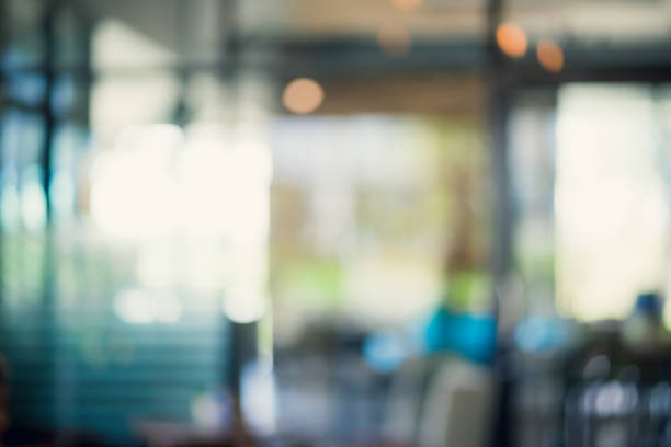 Abstract blur interior coffee shop or cafe for background. Abstract blur and defocused interior coffee shop or cafe for background. office window night stock pictures, royalty-free photos & images