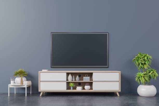istock TV on wall with cabinet in modern empty room 1070357732