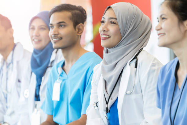 istock Group of medical students enjoy training class together 1070362156