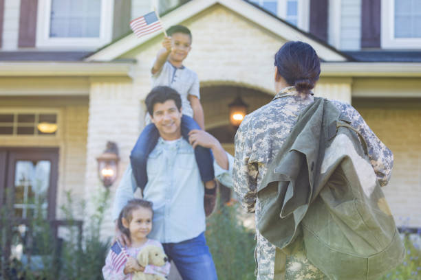 istock Female soldier greets family 1070362294