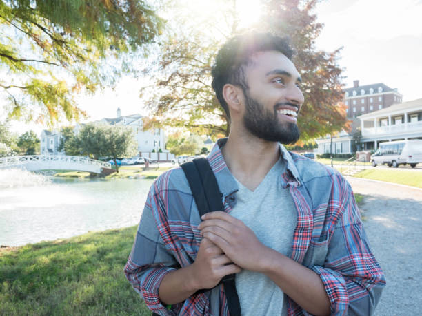 istock A male, student in college walks with his backpack 1070362354
