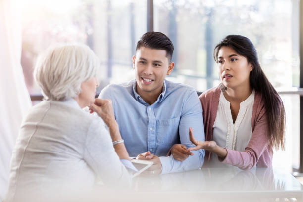 istock A young couple sit across from a senior counselor and talk 1070362412
