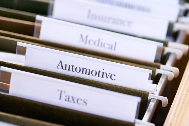 istock AUTOMOTIVE: Files and folders in desk drawer with labels and tabs: Home office management 1070362772