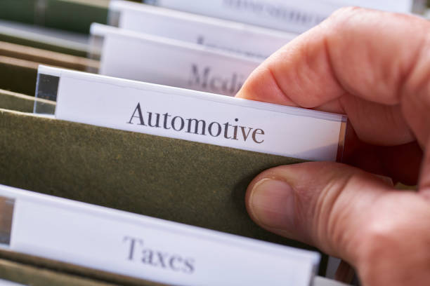 istock AUTOMOTIVE: Files and folders in desk drawer with labels and tabs: Home office management 1070362862