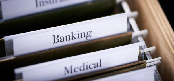 istock BANKING: Files and folders in desk drawer with labels and tabs: Home office management 1070366714