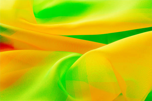 istock Texture, background, pattern. Silk fabric is transparent, dark orange, dark red, dark green, saturated colors. 1070366868