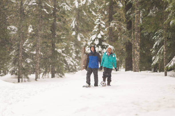 istock A senior couple snowshoeing in the forest 1070367046