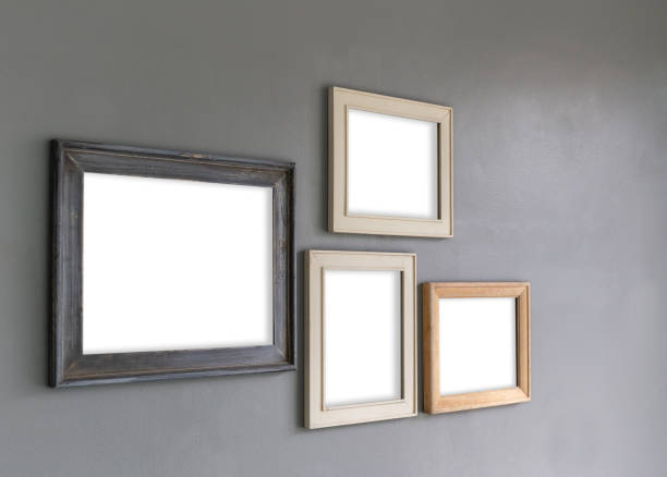 istock Group of Blank photo frames on the wall for your design 1070367058