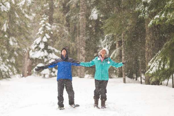 istock A senior couple snowshoeing in the forest 1070367072