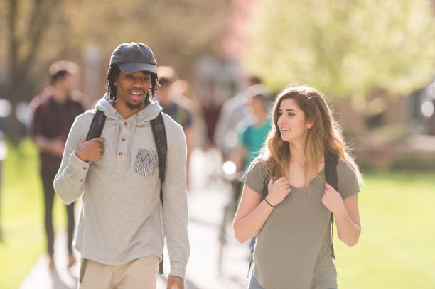 istock College students walking across campus to their classes 1070368926