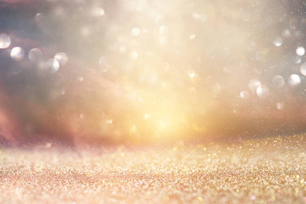 istock glitter vintage lights background. silver and gold. de-focused. 1070370988