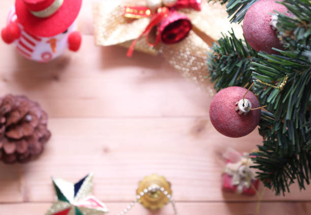 istock Christmas tree background with decorations on wooden board.selective focus at ball 1070376830