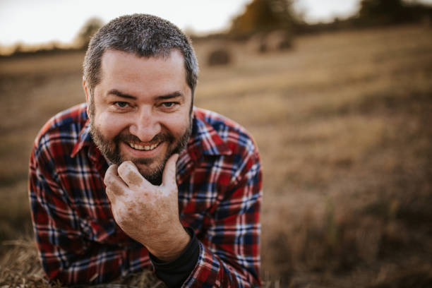 istock Farmer in a hay field 1070377752