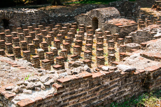Ruins of Roman Odeion and Thermae in ancient Greece city Dion. Archaeological park of sacred city of Macedon. Ancient Greece city Dion. Ruins of Roman Odeion and Thermae. Archaeological park of sacred city of Macedon. katerini greece photos stock pictures, royalty-free photos & images