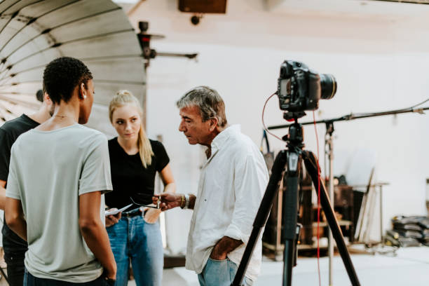 istock Photographer directing his shoot team 1070379186