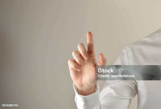 Businessman Touching Imaginery Screen Stock Photo - Download Image Now - Computer Monitor, Touching, Finger