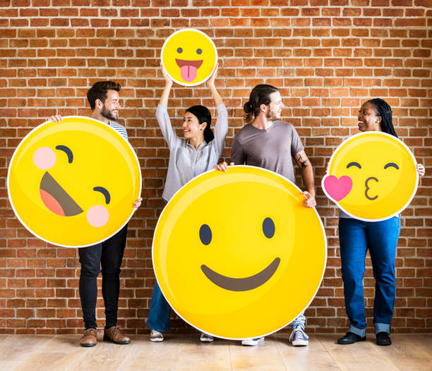 istock Diverse people holding positive emoticons 1070383840