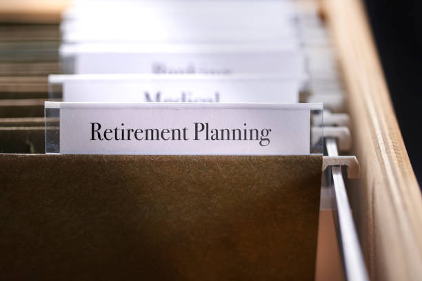 istock RETIREMENT: Files and folders in desk drawer with labels and tabs: Concept planning for retirement 1070384102