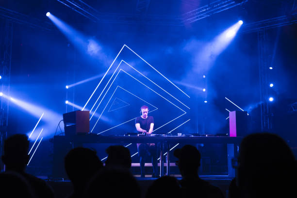 istock Dj playing techno music on the stage 1070387696